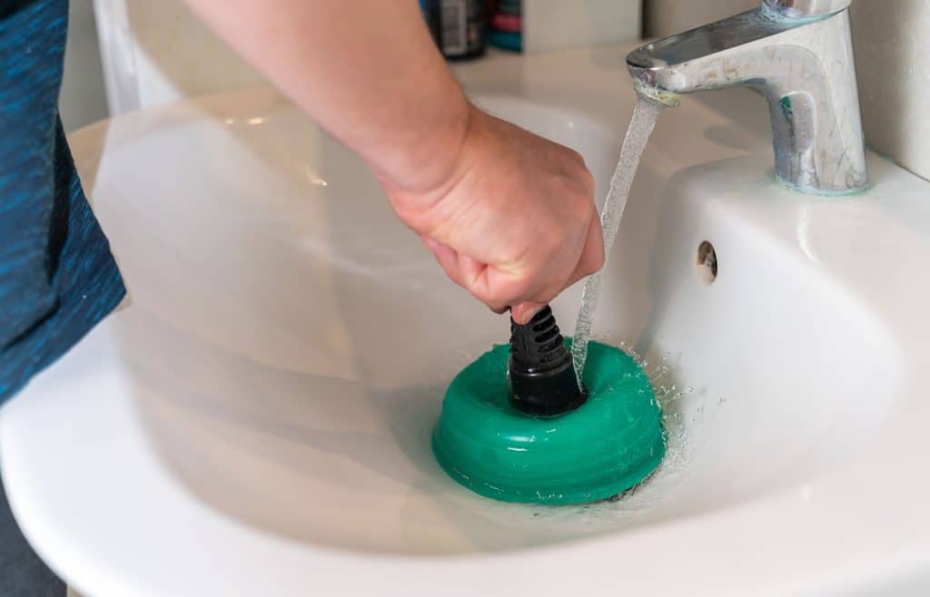 clearing drain with plunger in Atlanta