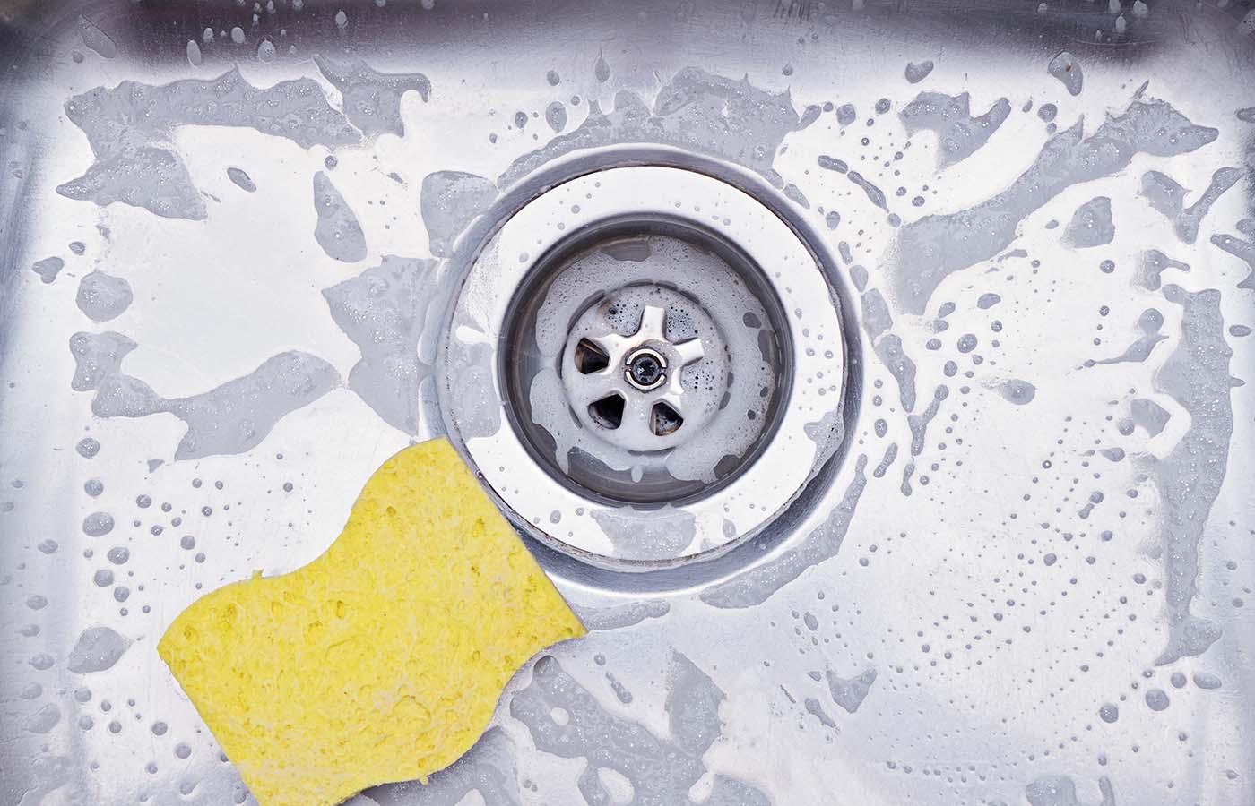 Closeup Sink Drain Yellow Sponge Cleaning